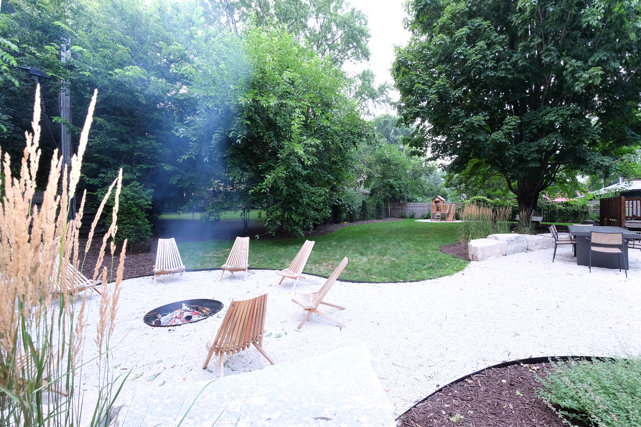Yard with firepit, dining, hammock, lounge areas, kids play area/ sand pit